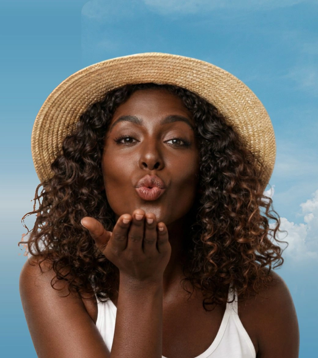 Traveller in a sun hat against a bright blue sky